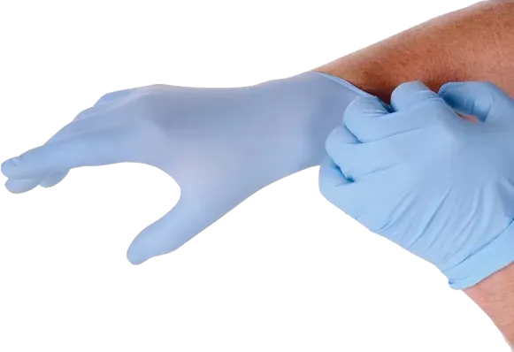 Hands pulling on a pair of blue nitrile medical gloves
